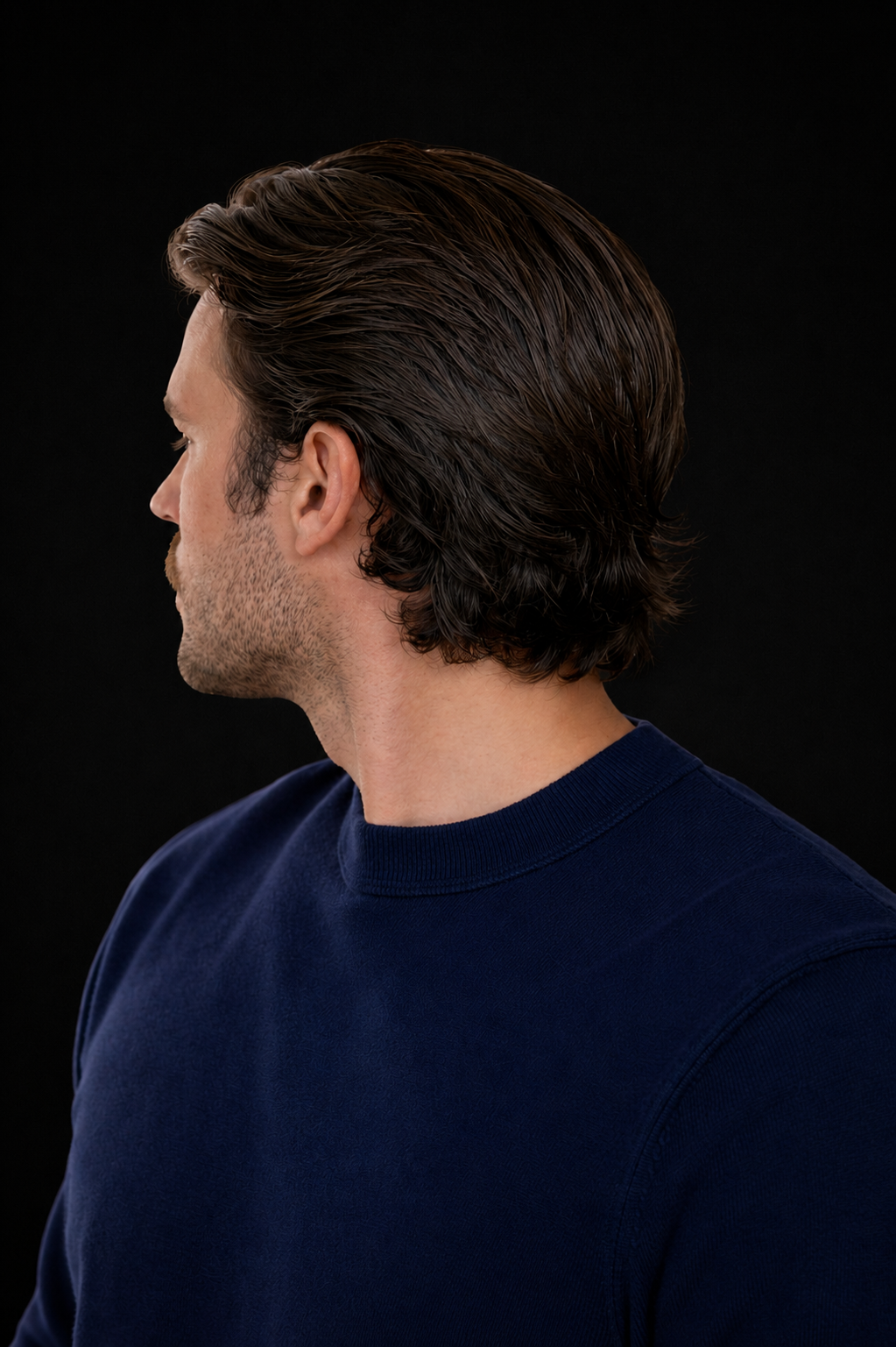 Side profile of a refined classic side part with low taper